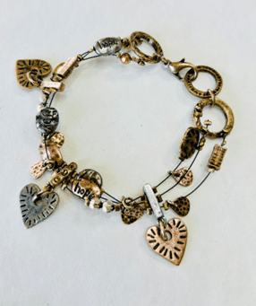 mixed metal charm bracelet with copper bronze and pewter links and charms