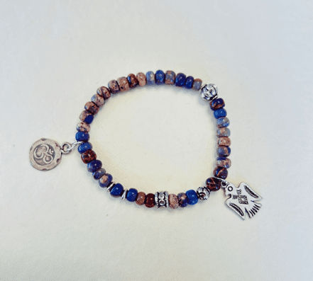 purple aragonite Om Firebird bracelet with symbolic charms