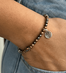 steel gray pearl mixed-metal bracelet, gray pearl bracelet, pearl and metal bracelet, brass copper pewter jewelry, sterling silver charm bracelet, artisanal pearl bracelet, mixed-metal beaded bracelet, boho metallic bracelet, handcrafted gemstone bracelet, edgy elegant bracelet, neutral palette jewelry, modern pearl bracelet, rustic pearl bracelet, earthy gemstone bracelet
