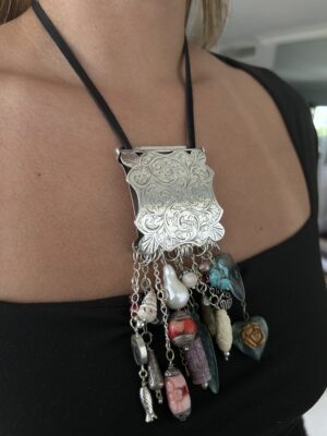 statement charm necklace with vintage belt buckle and mixed gemstones and charms