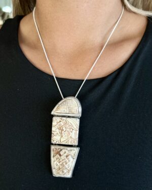 etched bone panels framed in sterling silver statement necklace inspired by Chinese artistry