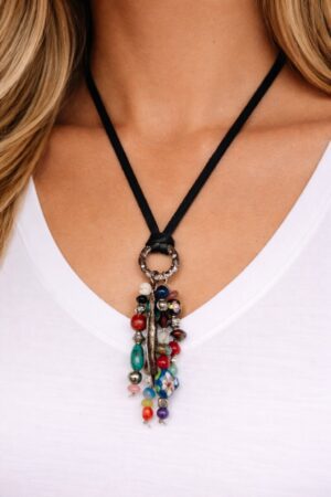 Gemstone Garden handcrafted statement necklace featuring turquoise, coral, and porcelain, by Watson Wells Jewelry