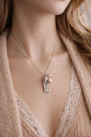 Sacred Peace handcrafted dainty necklace featuring pearl, crystal, and coral, by Watson Wells Jewelry